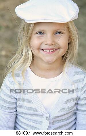 a young girl wearing a white cap; gresham, oregon, united states of america View Large Photo Image Stock Photo - a young girl wearing a white cap; gresham, oregon, united states of america. Fotosearch