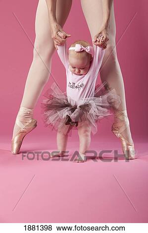 baby girl in tutu with a ballerina in pointe shoes View Large Photo Image Stock Photo - baby girl in tutu with a ballerina in pointe shoes. Fotosearch