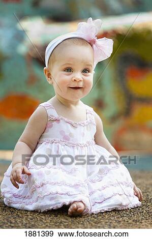 baby girl with a bow in her hair smiling; nashville, tennessee, united states of america View Large Photo Image Stock Photo - baby girl with a bow in her hair smiling; nashville, tennessee, united states of america. Fotosearch