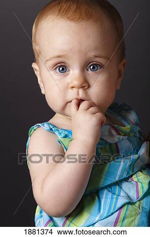 baby girl with finger in her mouth View Large Photo Image Picture - baby girl with finger in her mouth. Fotosearch