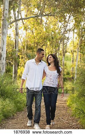 benalmadena costa, malaga, andalusia, spain; a couple walking down a path together View Large Photo Image Stock Photo - benalmadena costa, malaga, andalusia, spain; a couple walking down a path together. Fotosearch