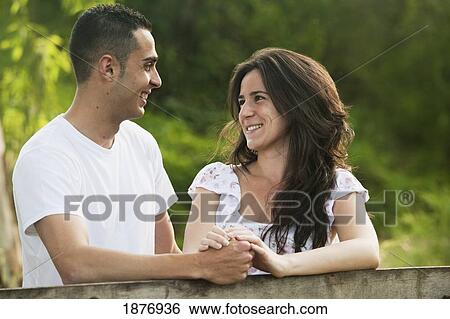 Stock Photograph - benalmadena costa, malaga, andalusia, spain; a couple looking at each other. Fotosearch