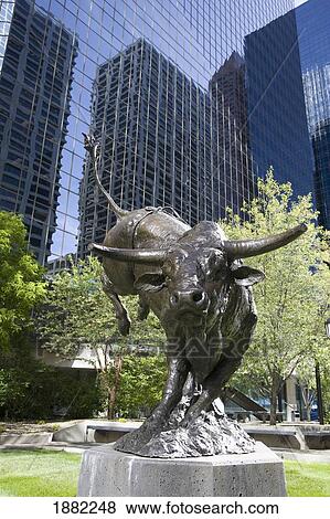 bronze bull sculpture with glass buildings and trees in the background; calgary, alberta, canada View Large Photo Image Stock Photo - bronze bull sculpture with glass buildings and trees in the background; calgary, alberta, canada. Fotosearch