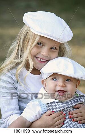 Stock Photo - children sitting together; gresham, oregon, united states of america. Fotosearch
