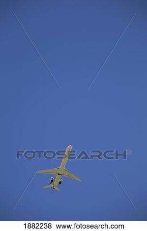 commerical plane in flight; calgary, alberta, canada View Large Photo Image Stock Photo - commerical plane in flight; calgary, alberta, canada. Fotosearch