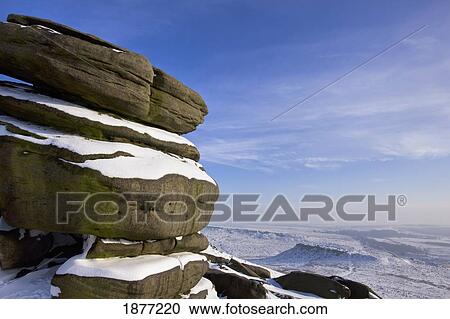 derbyshire, england; layers of snow and gritstone on higger tor in winter View Large Photo Image Stock Image - derbyshire, england; layers of snow and gritstone on higger tor in winter. Fotosearch