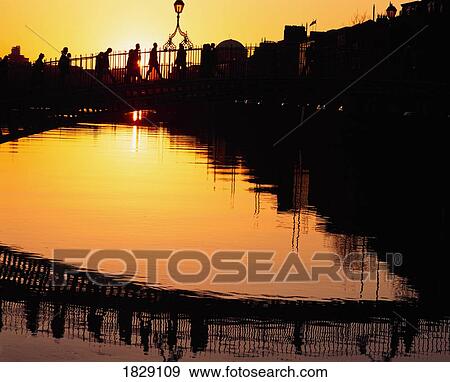Stock Photo - Dublin, Co Dublin, Ireland, Ha'penny Bridge, At Sunset. Fotosearch