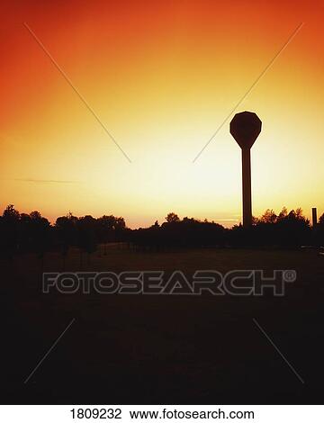 Stock Image - Dublin, Ireland; Watertower Silhouetted Against Majestic Sky. Fotosearch