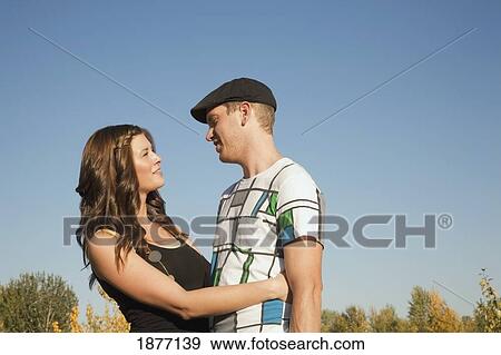 edmonton, alberta, canada; a couple in an embrace outdoors View Large Photo Image Stock Photo - edmonton, alberta, canada; a couple in an embrace outdoors. Fotosearch