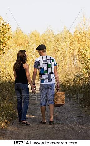 edmonton, alberta, canada; a couple walking down a path for a picnic View Large Photo Image Stock Image - edmonton, alberta, canada; a couple walking down a path for a picnic. Fotosearch