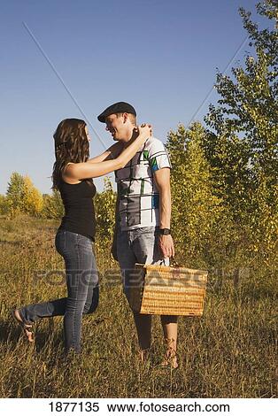 Stock Photography - edmonton, alberta, canada; a couple going on a picnic. Fotosearch