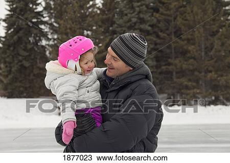 edmonton, alberta, canada; a father and daughter on an outdoor ice rink View Large Photo Image Stock Image - edmonton, alberta, canada; a father and daughter on an outdoor ice rink. Fotosearch