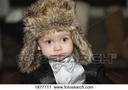 edmonton, alberta, canada; a young boy wearing a tuxedo and a fur hat View Large Photo Image Stock Image - edmonton, alberta, canada; a young boy wearing a tuxedo and a fur hat. Fotosearch