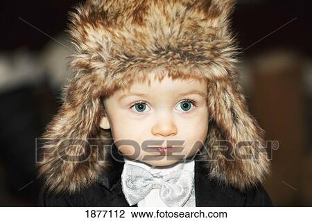 edmonton, alberta, canada; a young boy wearing a tuxedo and a fur hat View Large Photo Image Stock Image - edmonton, alberta, canada; a young boy wearing a tuxedo and a fur hat. Fotosearch