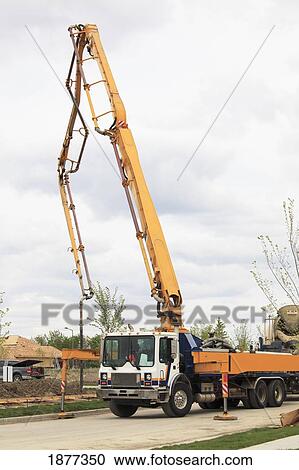 Stock Image - edmonton, alberta, canada; concrete pumper in a residential construction site. Fotosearch