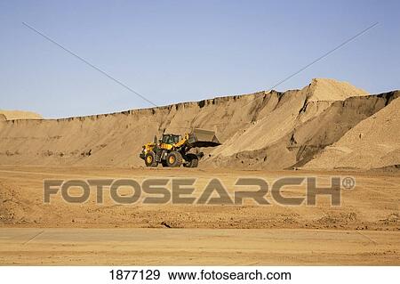 Stock Photo - edmonton, alberta, canada; moving dirt on a construction site. Fotosearch