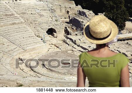 female tourist at greek amphitheatre; syracuse, sicily, italy View Large Photo Image Stock Photo - female tourist at greek amphitheatre; syracuse, sicily, italy. Fotosearch