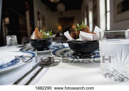 Stock Image - food on a table at rachamankha restaurant; chaing mai, thailand. Fotosearch