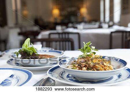 Stock Image - food on the table at rachamankha restaurant; chiang mai, thailand. Fotosearch