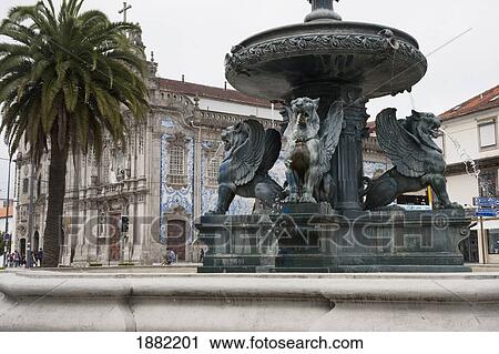 Stock Image - fountain with carmo church in the background; porto, portugal. Fotosearch
