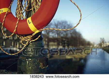 Stock Image - Grand Canal, Co Dublin, Ireland; View Of Canal, With Lifesaver In Foreground. Fotosearch