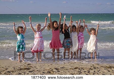 havana, cuba; young girls standing in the tide with arms raised View Large Photo Image Stock Image - havana, cuba; young girls standing in the tide with arms raised. Fotosearch