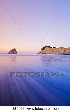 haystack rock in cape kiwanda at dawn; pacific city, oregon, united states of america View Large Photo Image Stock Image - haystack rock in cape kiwanda at dawn; pacific city, oregon, united states of america. Fotosearch
