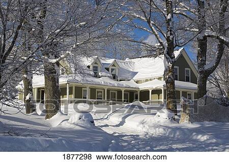 iron hill, quebec, canada; a house covered in snow in the winter View Large Photo Image Stock Photo - iron hill, quebec, canada; a house covered in snow in the winter. Fotosearch