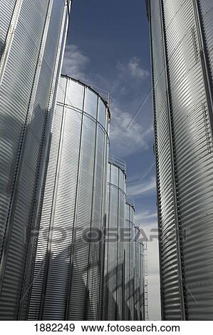 Stock Photo - large grain storage bins; alberta, canada. Fotosearch