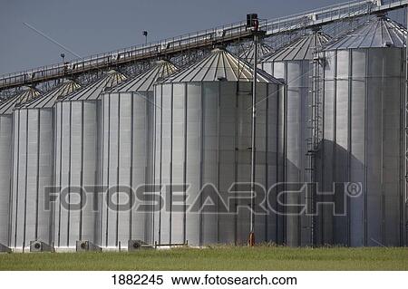Stock Photography - large grain storage bins; alberta, canada. Fotosearch