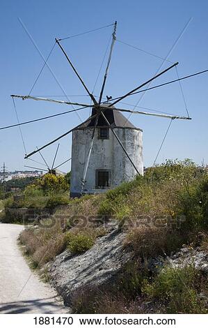 Stock Image - large windmill now used as a home; palmela, portugal. Fotosearch