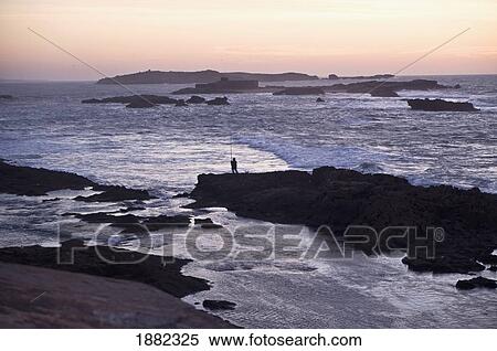 lone fishermen at dusk; essaouira, morocco View Large Photo Image Stock Photography - lone fishermen at dusk; essaouira, morocco. Fotosearch