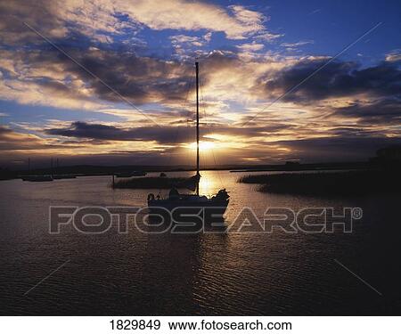Stock Photo - Lough Derg, Co Tipperary, Ireland; Boats In The Kikgarvan Harbour At Sunset. Fotosearch