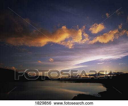Stock Photograph - Lough Inchiquinn, Near Kenmare, Co Kerry, Ireland; Sunset Over Lake. Fotosearch