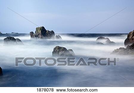 mist surrounding big rocks in the water; st. abb's head, northumberland, england View Large Photo Image Stock Photo - mist surrounding big rocks in the water; st. abb's head, northumberland, england. Fotosearch