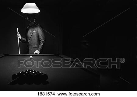 mystery pool player behind rack of billiard balls View Large Photo Image Picture - mystery pool player behind rack of billiard balls. Fotosearch