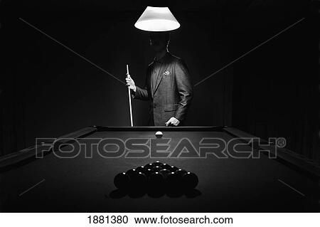 Stock Image - mystery pool player behind rack of billiard balls; edmonton, alberta, canada. Fotosearch
