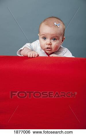 nashville, tennessee, united states of america; a baby girl propped up on a red wall View Large Photo Image Stock Photograph - nashville, tennessee, united states of america; a baby girl propped up on a red wall. Fotosearch