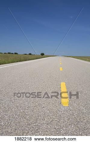 paved road with yellow stripe lines; alberta, canada View Large Photo Image Stock Photo - paved road with yellow stripe lines; alberta, canada. Fotosearch