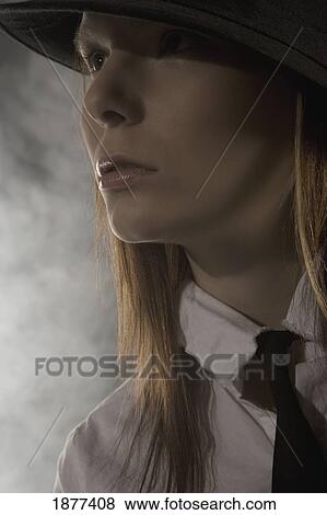 portrait of a woman wearing a hat and necktie View Large Photo Image Stock Photo - portrait of a woman wearing a hat and necktie. Fotosearch