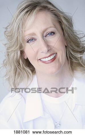 Stock Image - portrait of a woman wearing white. Fotosearch
