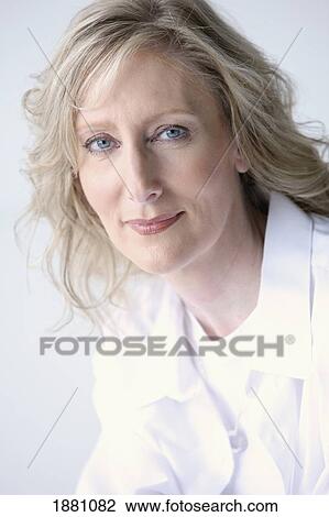 Stock Image - portrait of a woman wearing white. Fotosearch