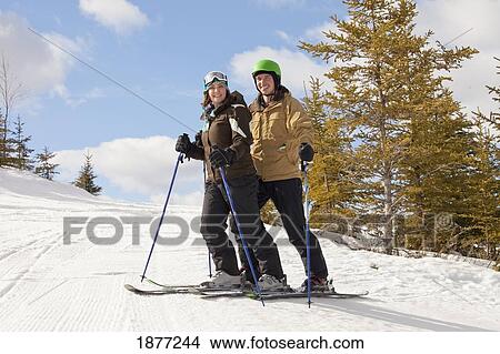 red deer, alberta, canada; a couple on a ski hill View Large Photo Image Picture - red deer, alberta, canada; a couple on a ski hill. Fotosearch