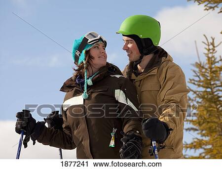 red deer, alberta, canada; a couple on a ski hill View Large Photo Image Stock Image - red deer, alberta, canada; a couple on a ski hill. Fotosearch