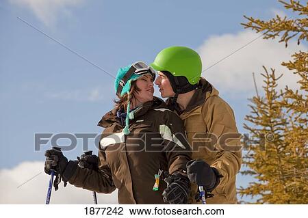 red deer, alberta, canada; a couple on a ski hill View Large Photo Image Stock Image - red deer, alberta, canada; a couple on a ski hill. Fotosearch