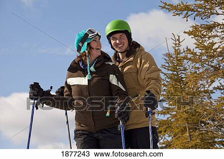 red deer, alberta, canada; a couple on a ski hill View Large Photo Image Stock Image - red deer, alberta, canada; a couple on a ski hill. Fotosearch