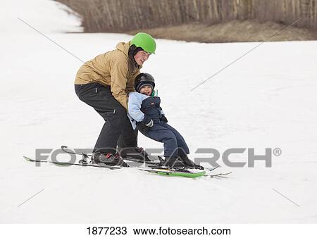 red deer, alberta, canada; a father and son skiing together on a hill View Large Photo Image Stock Image - red deer, alberta, canada; a father and son skiing together on a hill. Fotosearch