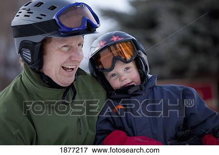 red deer, alberta, canada; a father and young son wearing helmets and ski masks View Large Photo Image Stock Photo - red deer, alberta, canada; a father and young son wearing helmets and ski masks. Fotosearch
