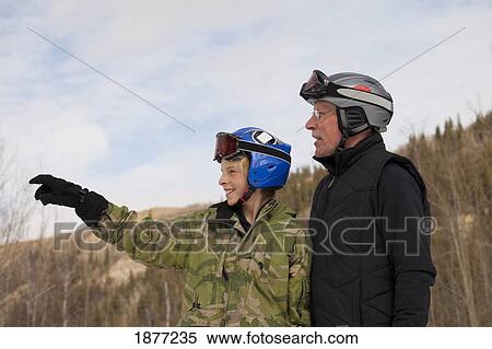 red deer, alberta, canada; a father and son wearing ski masks and helmets at a ski area View Large Photo Image Stock Photography - red deer, alberta, canada; a father and son wearing ski masks and helmets at a ski area. Fotosearch