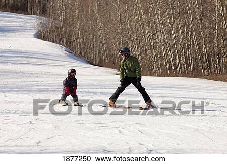 red deer, alberta, canada; a father teaches his young son how to ski View Large Photo Image Stock Image - red deer, alberta, canada; a father teaches his young son how to ski. Fotosearch